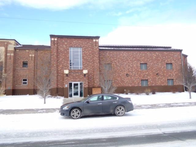 New jail front view with car parked in the street